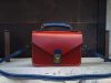 handcrafted structured messenger handbag with antique brass hardware