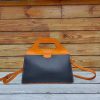 handcrafted minimalist top-handle handbag-structured shopper tote with protective studs