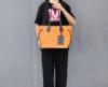 Minimalist handcrafted travel carryall ahdnabg with removeable clutch in italian veg-tan calfskin