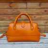 handmade architectural bowling tote handbag with sculptured silhouette in italian ve-tan calfskin