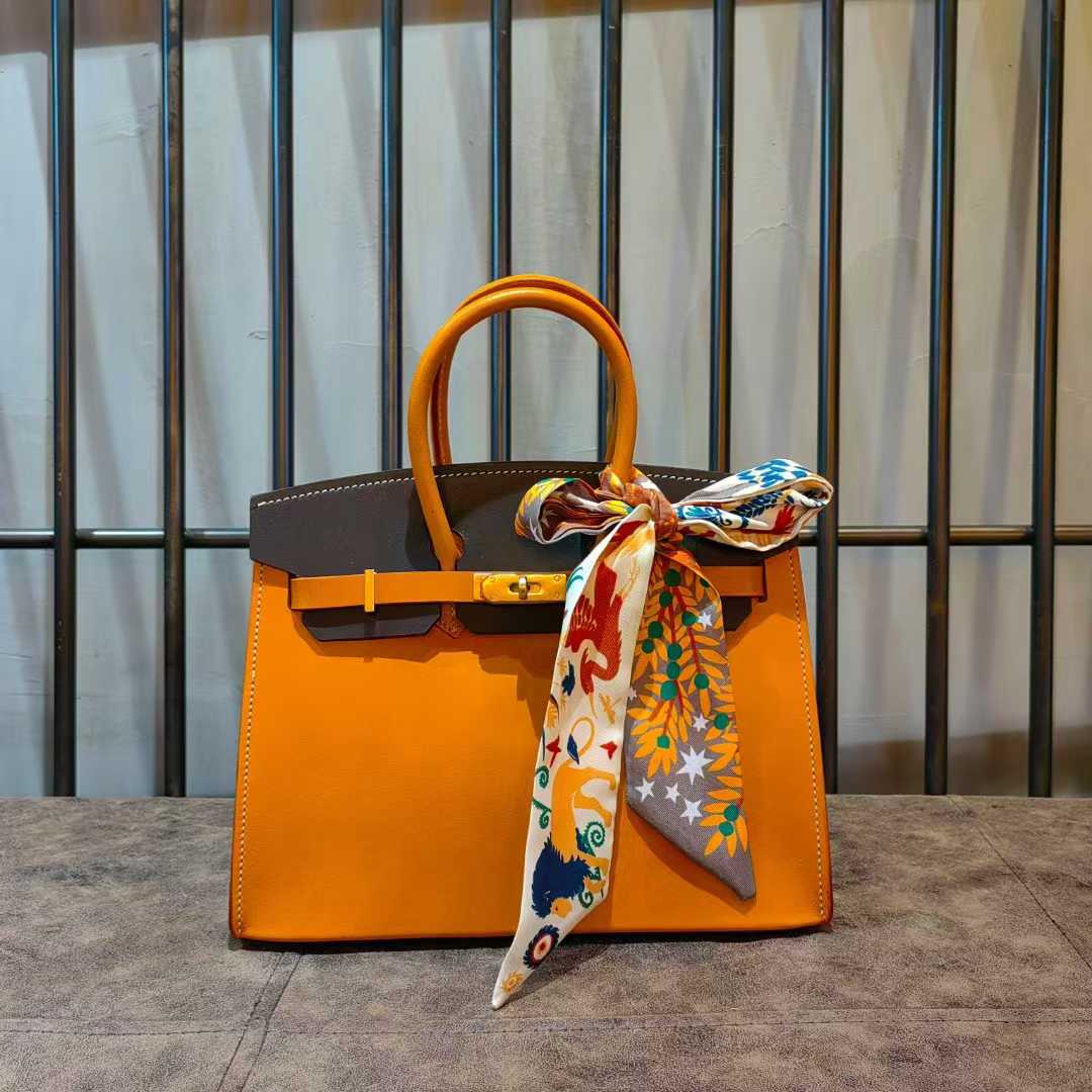 Orange leather bag with silk scarf