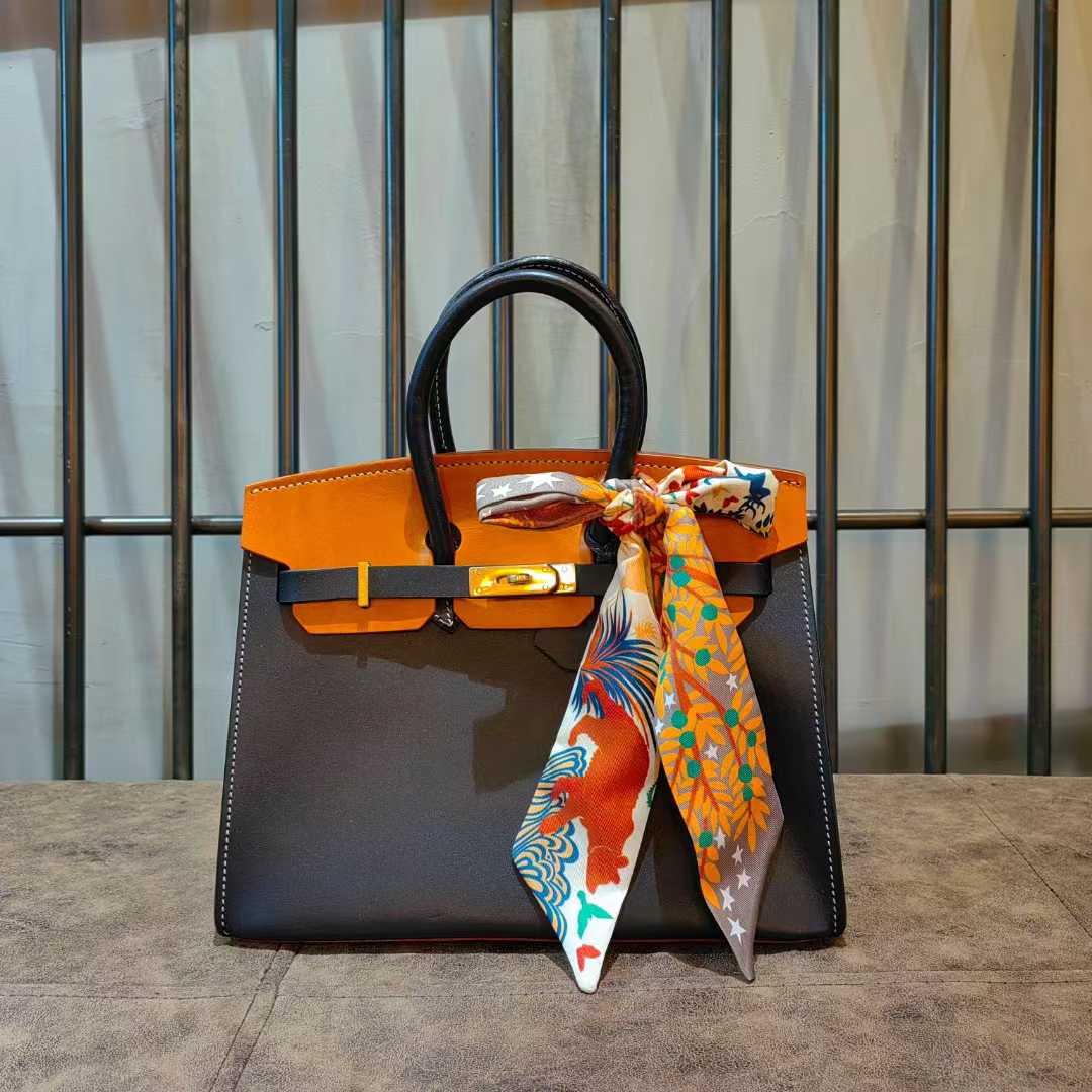 Charcoal bag with orange contrast flap