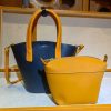 Minimalist structured bucket handbag with modular Zipper pouch